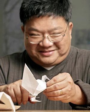 A paper turkey takes shape in the hands of Everett origami artist Duy Nguyen, author - 2004009778-300x0