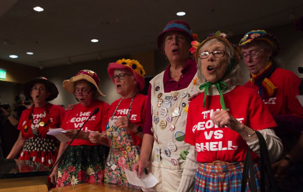 The Seattle “Raging Grannies” sing to Port of Seattle commissioners during public testimony on Tuesday about the contract with Foss Maritime at Seattle’s Terminal 5.  (Ellen M. Banner / The Seattle Times)