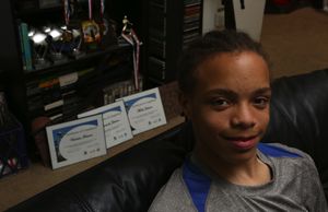 Eighth grader Malik Johnson has had a series of suspensions and other sanctions, culminating last year in an 11-day removal from school. (Ken Lambert / The Seattle Times)