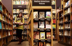 Alyssa Boggs, executive assistant at Amazon, works inside of Amazon Books, the company’s first brick-and-mortar store, Monday, Nov.