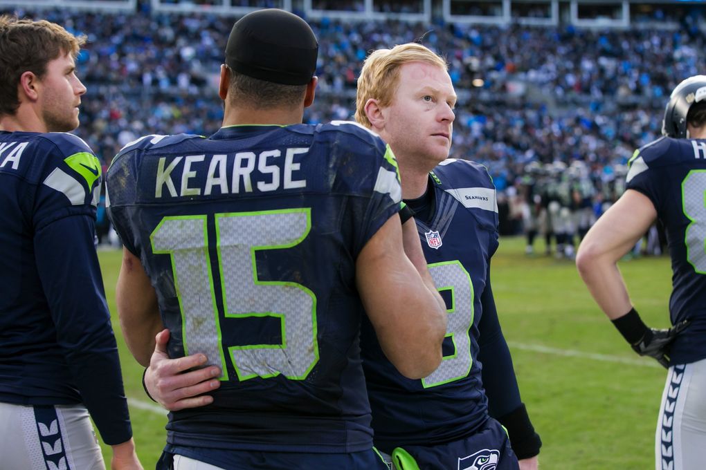 Seahawks wide receiver Jermaine Kearse gives a hug to punter Jon Ryan in the final minute as the Seattle Seahawks lost to the Panthers. (Bettina Hansen / The Seattle Times)