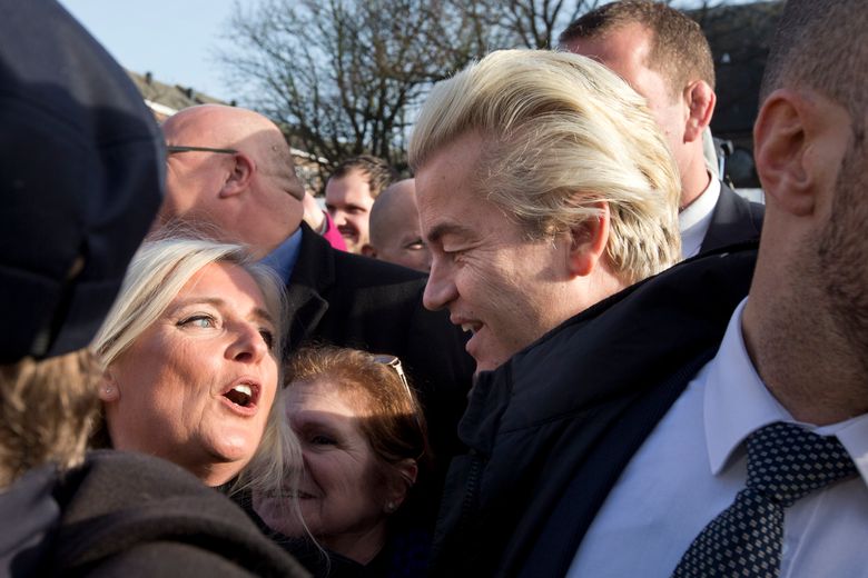 Firebrand Dutch lawmaker Geert Wilders talks to a woman after hands out “self-defense sprays” to women fearful of being attacked by migrants in the wake of the New Year’s Eve sexual assaults in Cologne, in the center of Spijkenisse, near Rotterdam, Netherlands, Saturday, Jan. (AP Photo/Peter Dejong)
