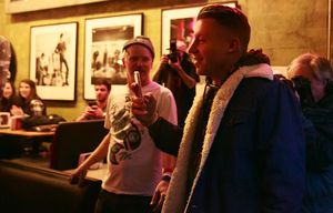 Macklemore enters Easy Street Records in West Seattle Friday, Feb. 26, 2016. 