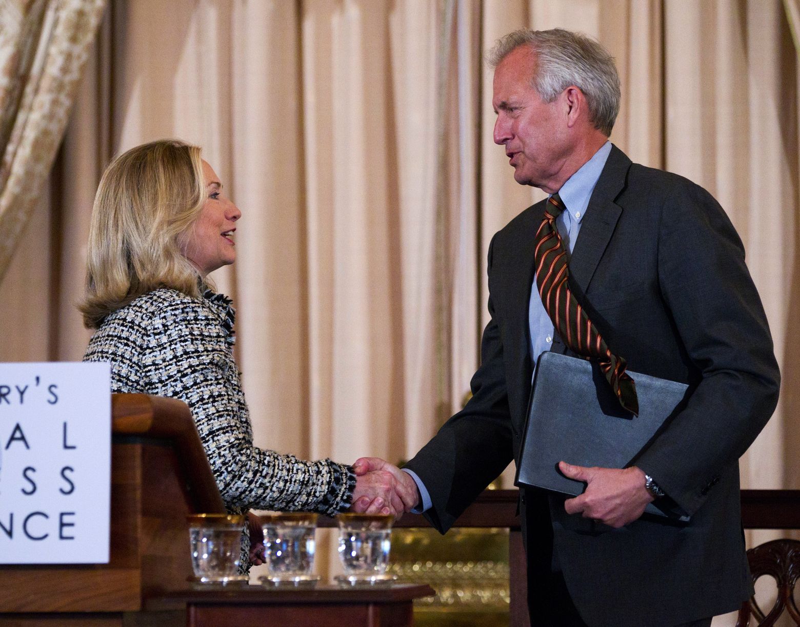 In 2012, Secretary of State Hillary Clinton greeted Boeing CEO Jim McNerney during the first-ever State Department Global Business Conference. (Manuel Balce Ceneta/AP)