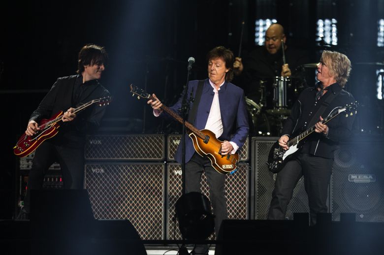 Paul McCartney performs “Save Us” with band members Rusty Anderson, left and Brian Ray during his “One on One” tour at KeyArena on Sunday, April 17, 2016. (Lindsey Wasson/The Seattle Times)