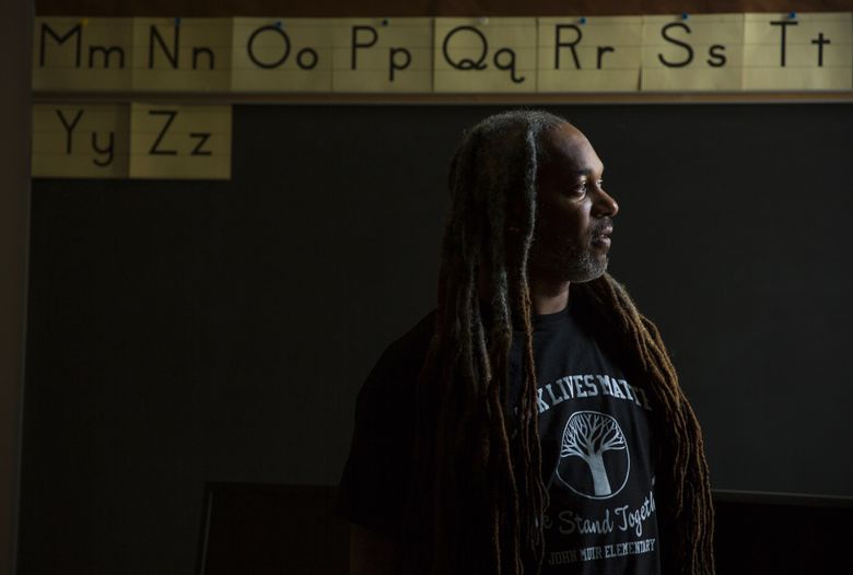 DeShawn Jackson is a teacher at John Muir Elementary in Seattle. The school was inundated with hateful messages after conservative news outlets posted stories about the school's teachers planning to wear Black Lives Matter shirts during an event to present black men in a positive light. The teachers say they wanted the event to focus on students, rather than serve as a political message. (Bettina Hansen/The Seattle Times)