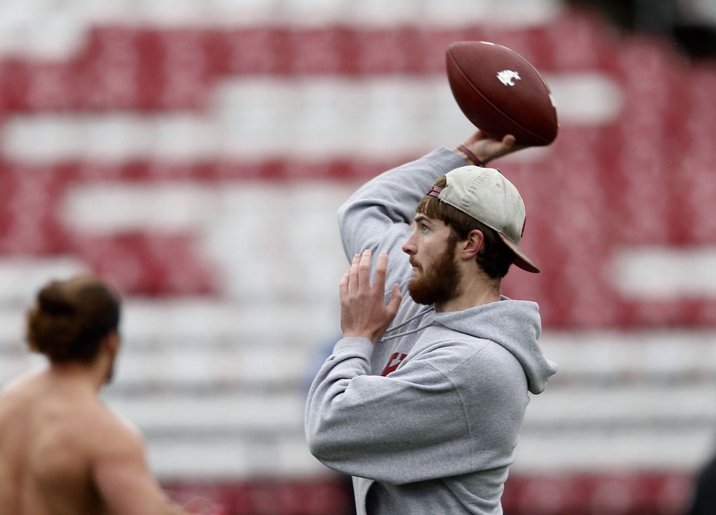 Washington State quarterback Luke Falk makes some warmup throws as he prepares for the 109th Apple Cup at Martin Stadium in Pullman, Wash. (Lindsey Wasson / The Seattle Times)