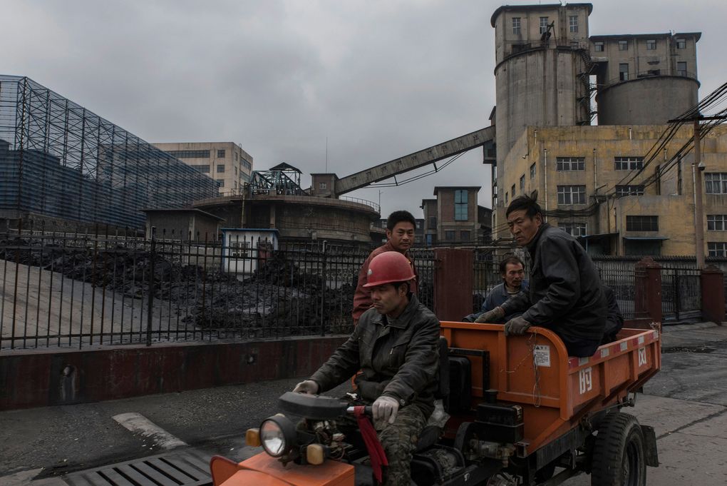 A crew works at a coal plant in Jinching, China, that recently resumed production to meet increased demand before winter snows arrive. (GILLES SABRIE/NYT)