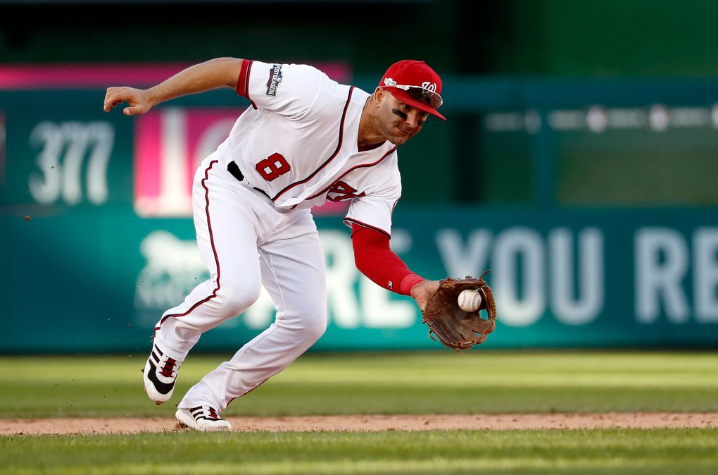 FILE- In this Oct. 9, 2016, file photo, Washington Nationals shortstop Danny Espinosa (8) fields a ground ball during Game 2 of baseball’s National League Division Series against the Los Angeles Dodgers in Washington. (8) fields a ground ball during Game 2 of baseball’s National League Division Series against the Los Angeles Dodgers in Washington. The Los Angeles Angels have acquired shortstop Espinosa from the Washington Nationals for two minor league pitchers. (AP Photo/Alex Brandon, File)