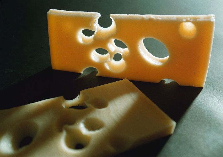 Mystery of disappearing holes in Swiss cheese solved | The Seattle Times