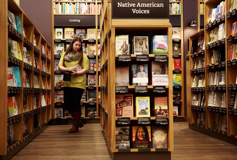 Alyssa Boggs, executive assistant at Amazon, works at Amazon Books, the company’s first brick-and-mortar store. (Erika Schultz/The Seattle Times)