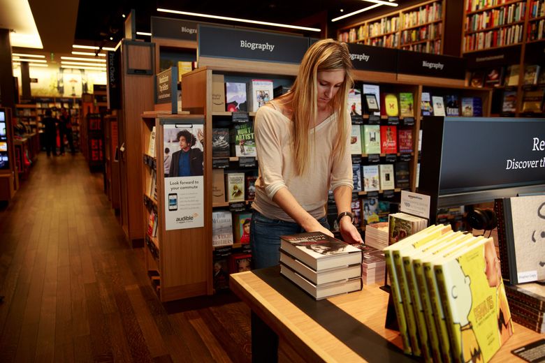 Amazon’s Annie Zamojski works inside the company’s first brick-and-mortar bookstore in Seattle. (Erika Schultz/The Seattle Times)