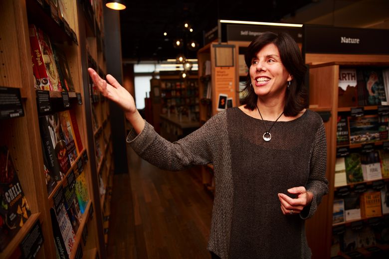 Jennifer Cast, vice president of Amazon Books, gives a tour of Amazon Books’ new 5,500-square-foot retail space in Seattle’s University District. (Erika Schultz/The Seattle Times)