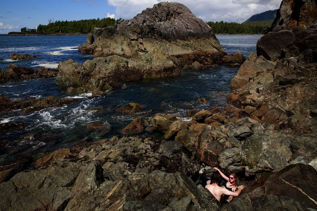 ride a boat through wild waters to hot springs near tofino