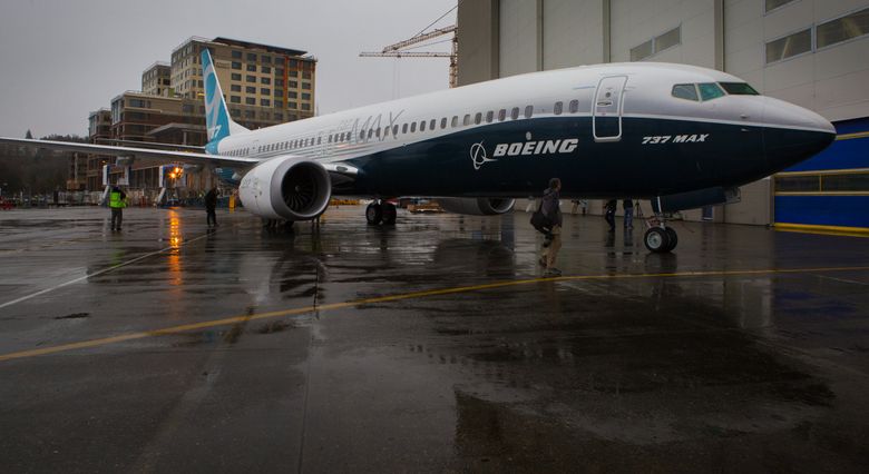 Members of the media photograph the first Boeing 737 MAX 9 airplane that rolled out of the Renton factory Tuesday morning Ellen M BannerThe Seattle Times