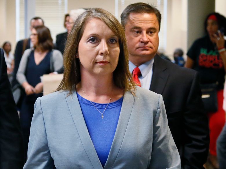 Betty Shelby leaves the courtroom with her husband Dave Shelby right after the jury in her case began deliberations in Tulsa Okla. Wednesday
