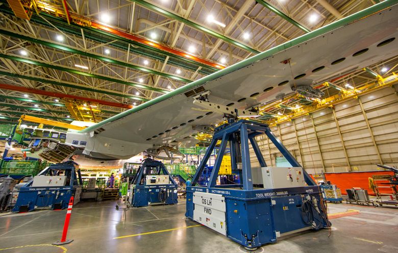 The Boeing 777 wings are attached to the wing box using three hydraulic jacks allowing more flexibility in attaching and working on the wings. (The 777X wings will also be attached using these jacks.)  (Mike Siegel/The Seattle Times)