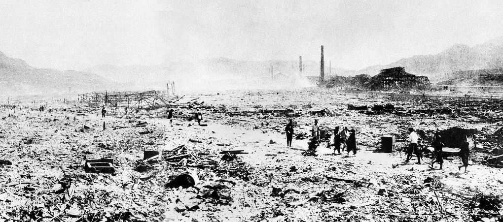People walk through the debris shortly after the bomb was dropped on Nagasaki on Aug. 9, 1945. This photo, obtained by the U.S. Army from the official Japanese news agency Domei, offered the first ground view of Nagasaki’s destruction to be distributed. Japanese estimates of the death toll, as of December 1945, topped 73,000 in the city of about 240,000. Many survivors suffered severe burns and radiation sickness.  (The Associated Press)