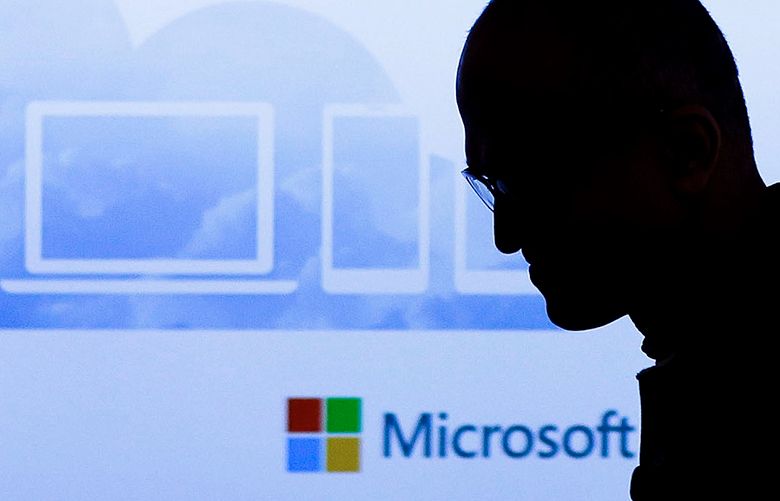 Microsoft has replaced technical speak with brand names on many products, but that has opened up new challenges. Seen here is Microsoft CEO Satya Nadella exiting the stage after speaking at a press briefing in San Francisco. (Eric Risberg/AP)