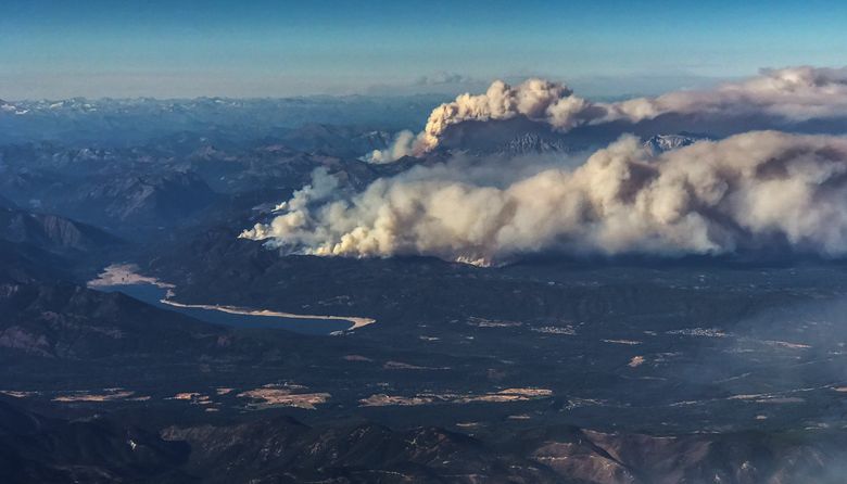 From a jetliner coming into Sea-Tac Airport on Saturday, smoke from Central Washington wildfires can be seen.  (Dean Rutz / The Seattle Times )