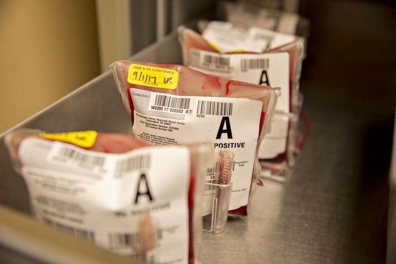 Pouches of donor blood sit in a refrigerated drawer. (Daniel Acker/Bloomberg)