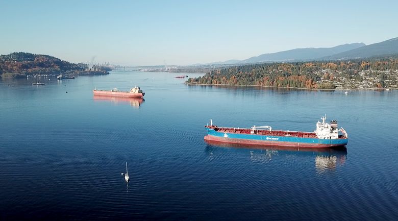 Two oil tankers sit in calm waters on Oct. 28, 2017, in the Burrard Inlet near Vancouver, B.C., just off the site of Kinder Morgan’s Westridge Terminal. (Photo by Howie Chong / Stand.earth, Courtesy to The Seattle Times) 