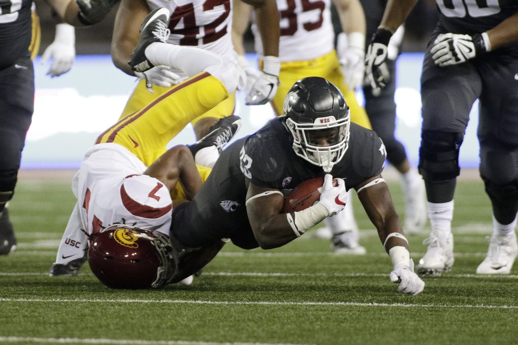 Southern California safety Marvell Tell III (7) tackles Washington State running back Gerard Wicks (23) during the second half of an NCAA college football game in Pullman, Wash., Friday, Sept. 29, 2017. (AP Photo/Young Kwak) OTK OTK (Young Kwak / The Associated Press)