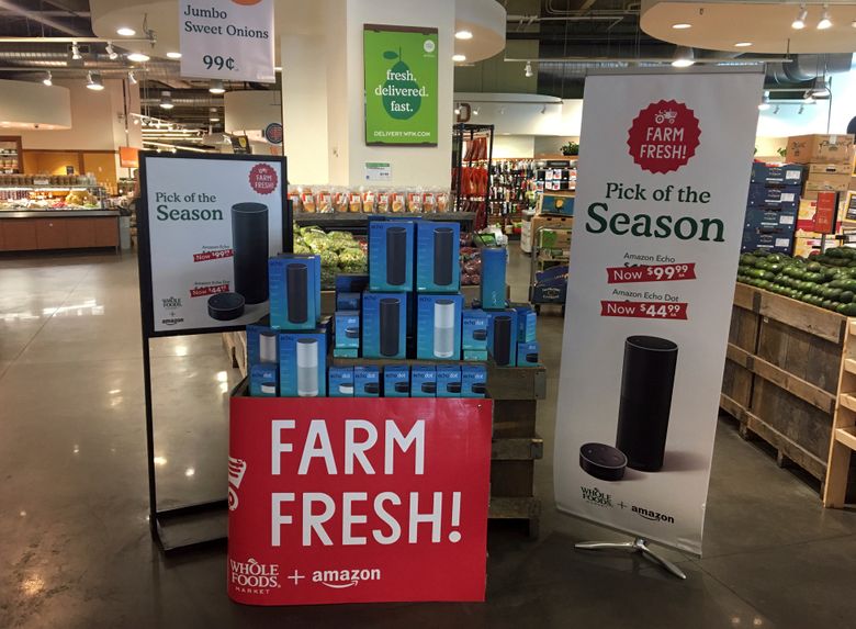 You may see more of Amazon inside Whole Foods soon: The online retailer, which has been already been selling its voice-activated Echos at Whole Foods, will start to sell Kindles, Fire tablets and other Amazon devices at its grocery stores. Shown here are Amazon’s Echo and Echo Dot appear on sale at a Whole Foods Market in New York in August. (AP Photo/Joseph Pisani, File)