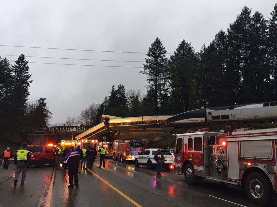 The southbound lanes of Interstate 5 were blocked near Mounts Road in Pierce County after a train derailed off an overpass on Monday morning.  Photograph: Washington State Department of Transportation.