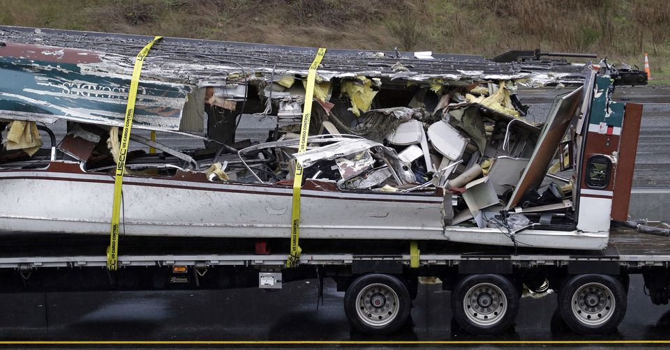 Seats are jammed together with other debris on an upside-down Amtrak train car taken from the scene of Monday's deadly crash onto Interstate 5. — Photograph: Elaine Thompson/The Associated Press.