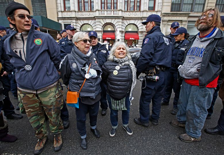 Demonstrators arrested protesting the detention of detained Ravi Ragbir, a prominent immigration activist, Thursday, Jan. 11, 2017, in New York. New York City police have arrested more than a dozen people, including two councilmen, in protests over the detention of the activist. (AP Photo/Kathy Willens)