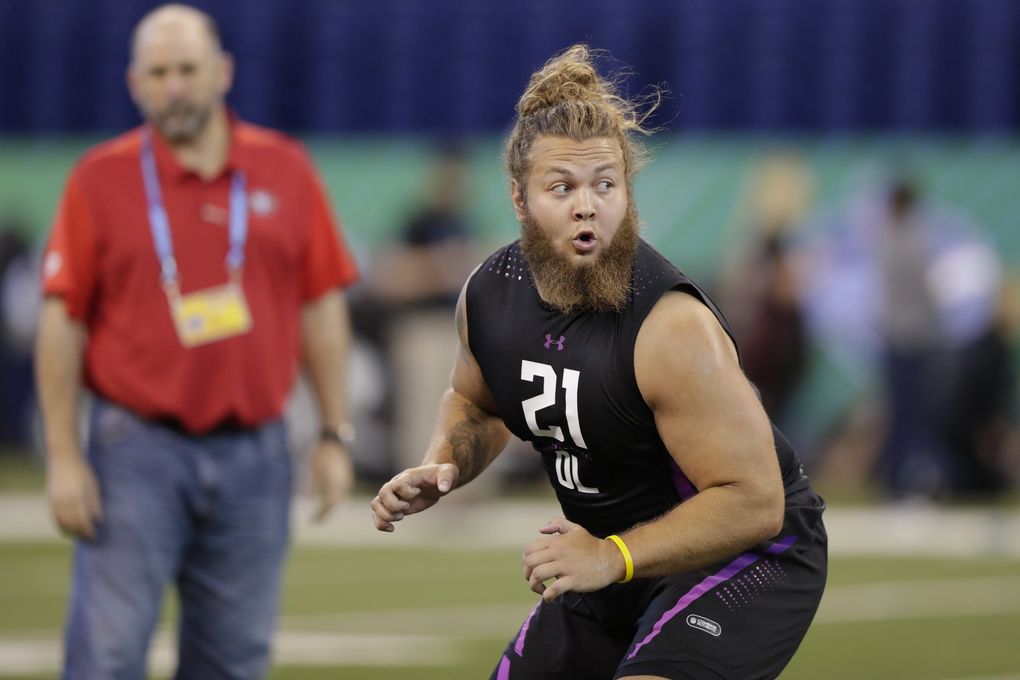 Washington State offensive lineman Cole Madison runs a drill at the NFL football scouting combine in Indianapolis, Friday, March 2, 2018. (AP Photo/Michael Conroy) INMC10 INMC10 (Michael Conroy / The Associated Press)