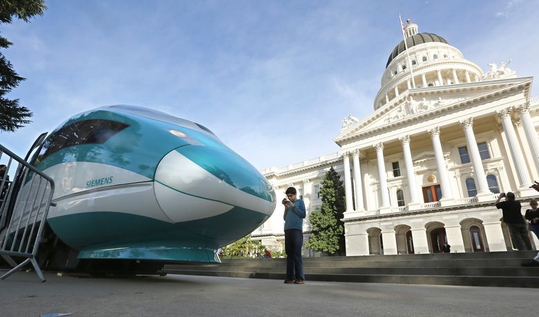 A full-scale mock-up of a high-speed train is displayed at the Capitol in Sacramento, California, in 2015. A 520-mile Los Angeles-to-San Francisco line was approved 10 years ago. The cost has soared by the billions and the train has yet to be built. Washington Gov. Jay Inslee now says he wants a bullet train — a “monument to optimism,” he calls it. (Rich Pedroncelli/The Associated Press)