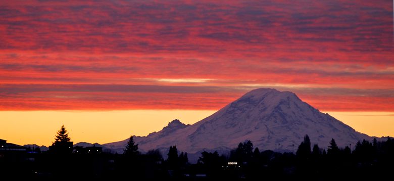 Mount Rainier is one of three national parks in Washington state to receive a $1 million donation from the estate of a woman who loved the outdoors. (Elaine Thompson / AP, 2011)