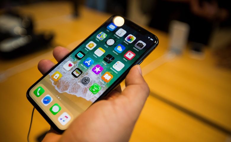 Apple said the change, which would disable the Lightning port on the bottom edge of iPhones an hour after users lock their phones, is part of a security upgrade to better protect the private information of iPhone users. (Michael Nagle / Bloomberg)