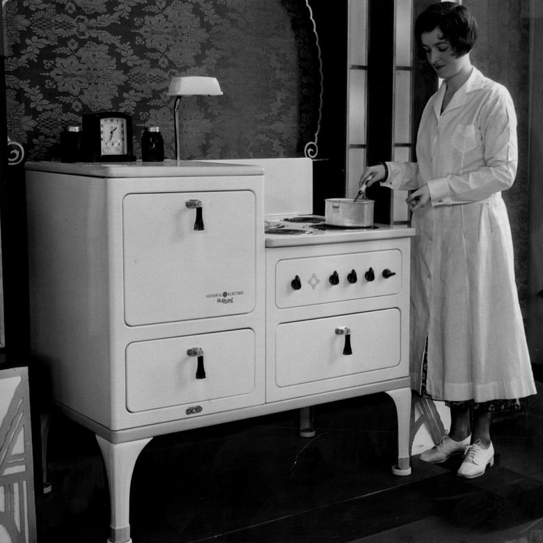 Cooking with a General Electric Hotpoint Range in the 1930s is Marion Ferriss Guinn, one of the first of many given the nom de plume Dorothy Neighbors during the five-plus decades (1927-1980) the home-economics department.  Photograph: Seattle Times archives.