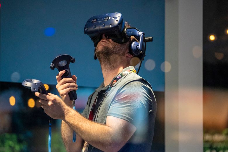 Todd Stoudnor tries his hand at the Bethesda VR game on Tuesday, the opening day of the video-game convention E3 2018 in Los Angeles.  (Irfan Khan/TNS)