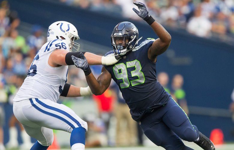 Seattle Seahawks defensive end Branden Jackson (93) blocks Indianapolis Colts offensive guard Quenton Nelson (56) as the Seattle Seahawks play the Indianapolis Colts at CenturyLink Field in Seattle on August 9, 2018. 207349