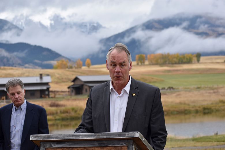 .S. Interior Secretary Ryan Zinke announces on October 18, 2018, a ban on mining claims north of Yellowstone National Park as K.C. Walsh, left, president of Simms Fishing Products, listens near Emigrant, Montana. — Photograph: Matthew Brown/Associated Press.