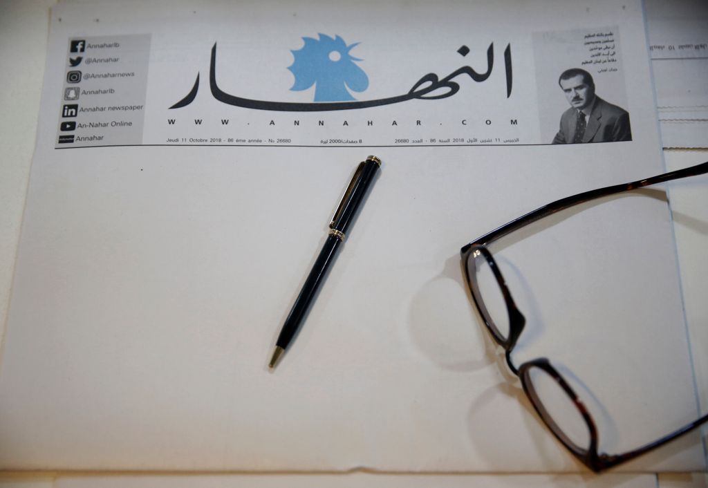 A copy of a blank published An-Nahar newspaper, on a journalist’s desk at the paper’s headquarters, in downtown Beirut, Lebanon, Thursday, Oct. 11, 2018. Lebanon’s leading newspaper has published a blank issue as a strong protest against the paralysis in the country and politicians’ inability to form a government. (AP Photo/Hussein Malla)