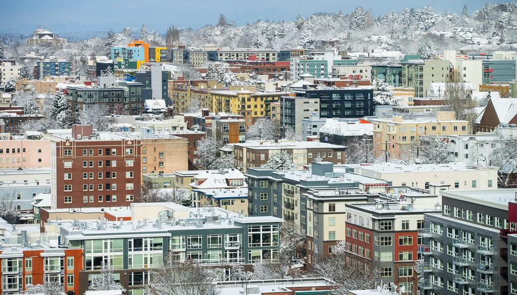 A snow-covered Capitol Hill neighborhood, viewed from First Hill on Saturday.  (Mike Siegel / The Seattle Times)