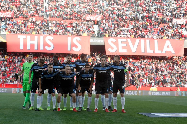 Lazio players pose for a team picture before the Europa League round of 32 second leg soccer match between Sevilla and Lazio at the Sanchez Pizjuan stadium, in Seville, Spain, Wednesday, Feb. 20, 2019. (AP Photo/Miguel Morenatti)