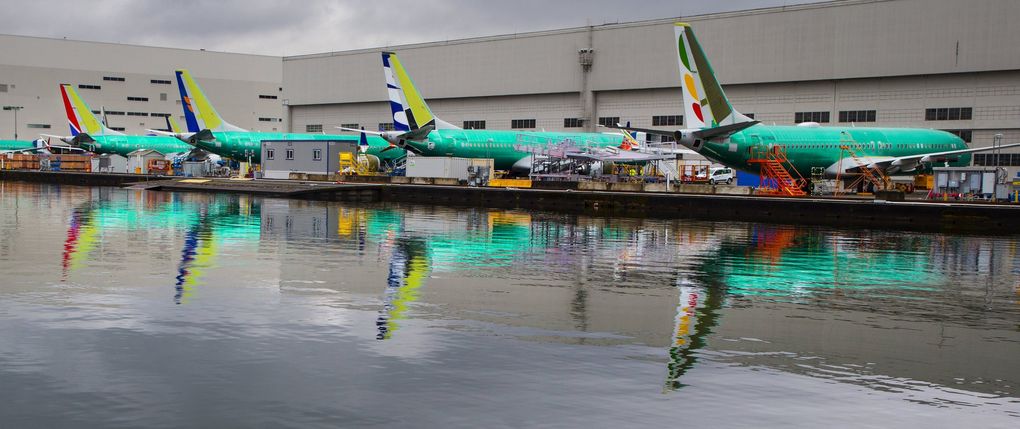 Boeing 737 MAX planes sit in a row last week behind the Renton plant on the south shore of Lake Washington. (Mike Siegel / The Seattle Times)