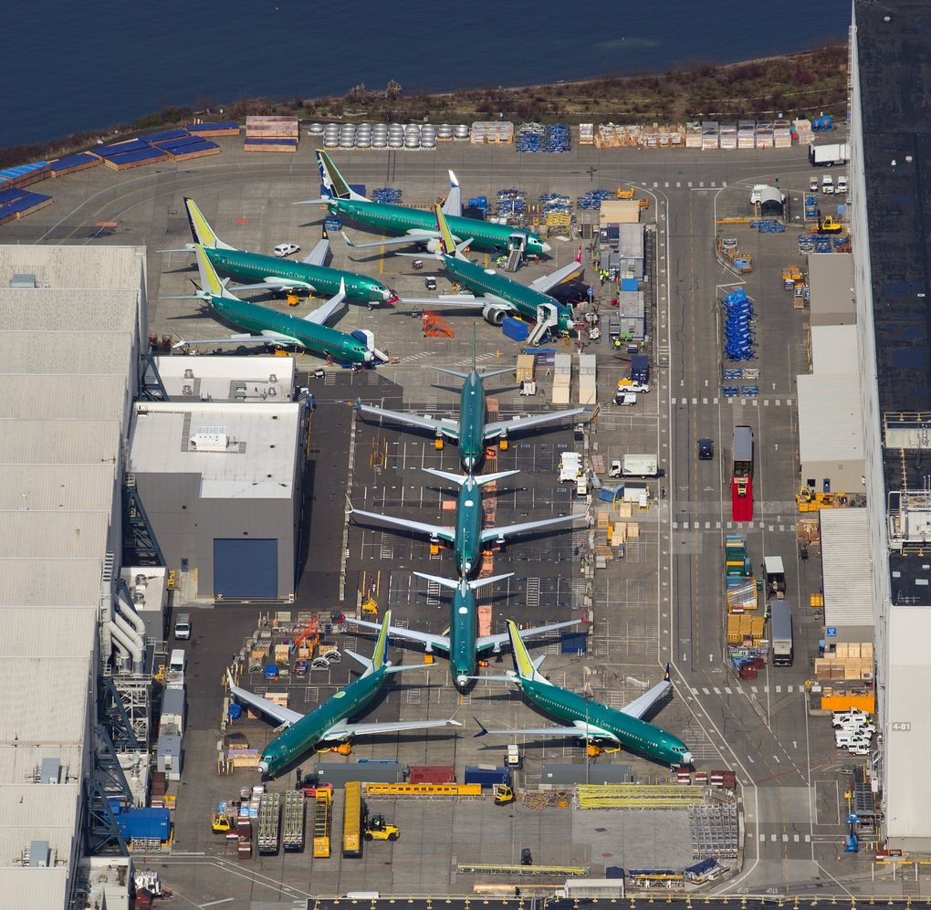 Boeing 737s, many of which are MAX 8 and 9 aircraft in various stages of completion, are parked next to the 737 factory in Renton. (Mike Siegel / The Seattle Times)