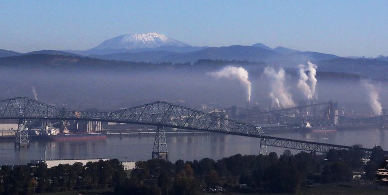 The industrial port of Longview, Washington with Mount St. Helens rising in the background.
The view of the port and the Columbia River is from the Oregon side of the river.  (Alan Berner / The Seattle Times)