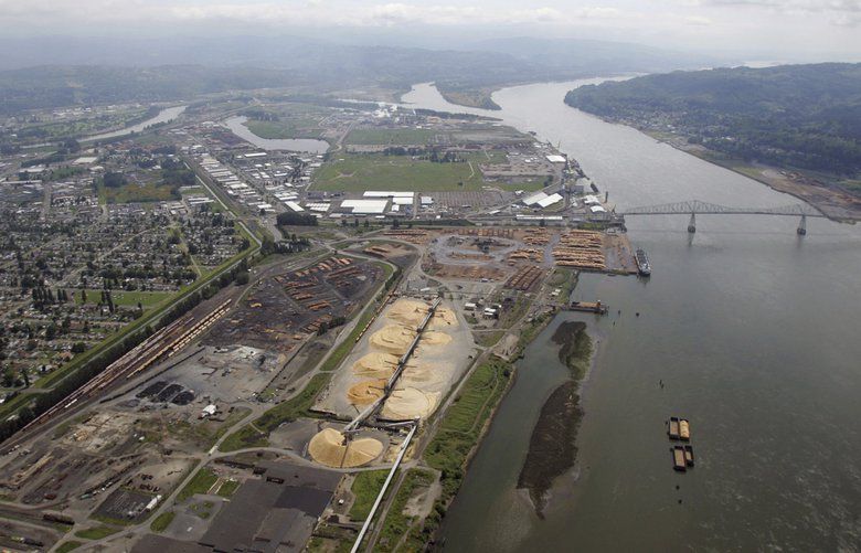 FILE- This May 12, 2005, file photo, shows the port of Longview on the Columbia River at Longview, Wash. A judge says Washington state's Department of Natural Resources acted arbitrarily when it blocked a sublease sought by developers of a proposed coal-export terminal near Longview. (AP Photo/Elaine Thompson, File) PDX517 PDX517
