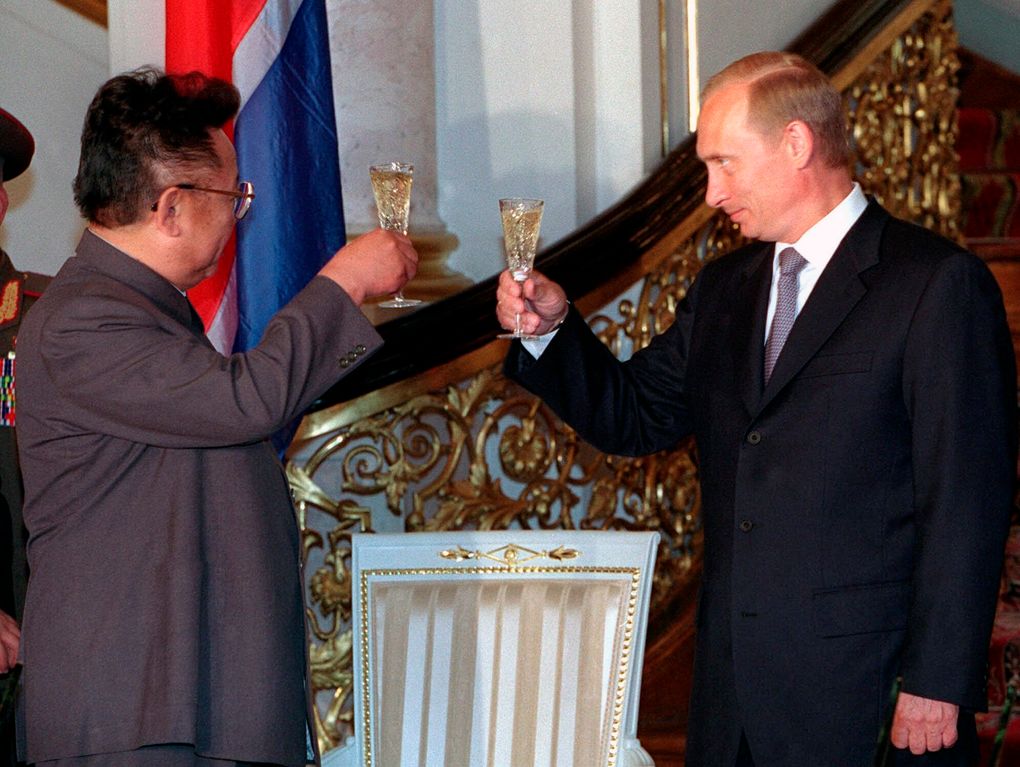 Russian President Vladimir Putin, right, clinks glasses with North Korean leader Kim Jong Il during their meeting at the Kremlin in Moscow, Russia on Saturday, August 4, 2001. North Korean leader Kim Jong Un's summit with Russian President Vladimir Putin this week expands a diplomatic charm offensive that has included meetings with leaders from China, South Korea and the United States. — Photograph: Vladimir Vyatkin/Sputnik/Kremlin Pool Photo/via Associated Press.