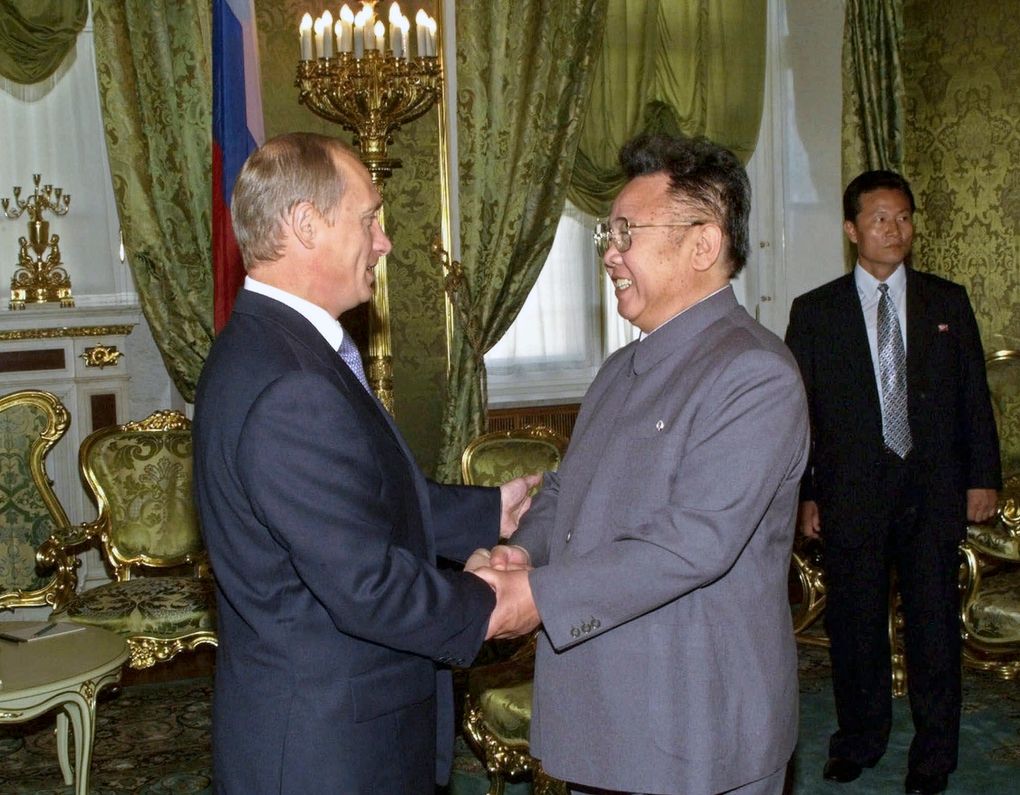 Russian President Vladimir Putin, left, shakes hands with North Korean leader Kim Jong Il, during their meeting in Moscow, Russia on Saturday, August 4, 2001. North Korean leader Kim Jong Un's summit with Russian President Vladimir Putin this week expands a diplomatic charm offensive that has included meetings with leaders from China, South Korea and the United States. — Photograph: Sergei Velichkin/TASS/Sputnik/Kremlin Pool Photo/via Associated Press.