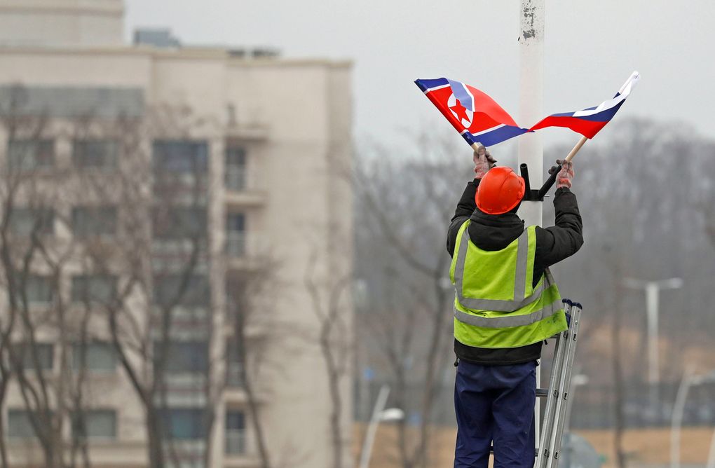 A worker adjusts the flag of Russia and North Korea along the road in Russky Island, off the southern tip of Vladivostok, on Tuesday, April. 23, 2019. Preparations are underway for a summit between the leader of North Korea and Russia’s president, Russian officials and media reported on Tuesday. Russian media have widely reported that the leaders will meet in the port city of Vladivostok on the Pacific Ocean. — Photograph: Naoya Osato/Kyodo News/via Associated Press.