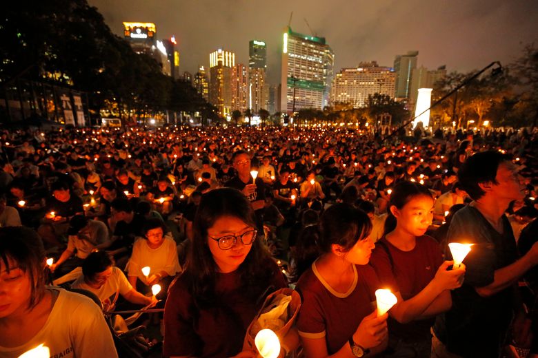 A June 4 vigil in Hong Kong for victims of 1989âs Tiananmen Square Massacre. Wednesday police clashed with protesters of a bill permitting extraditions from Hong Kong to mainland China. (AP Photo / Kin Cheung)